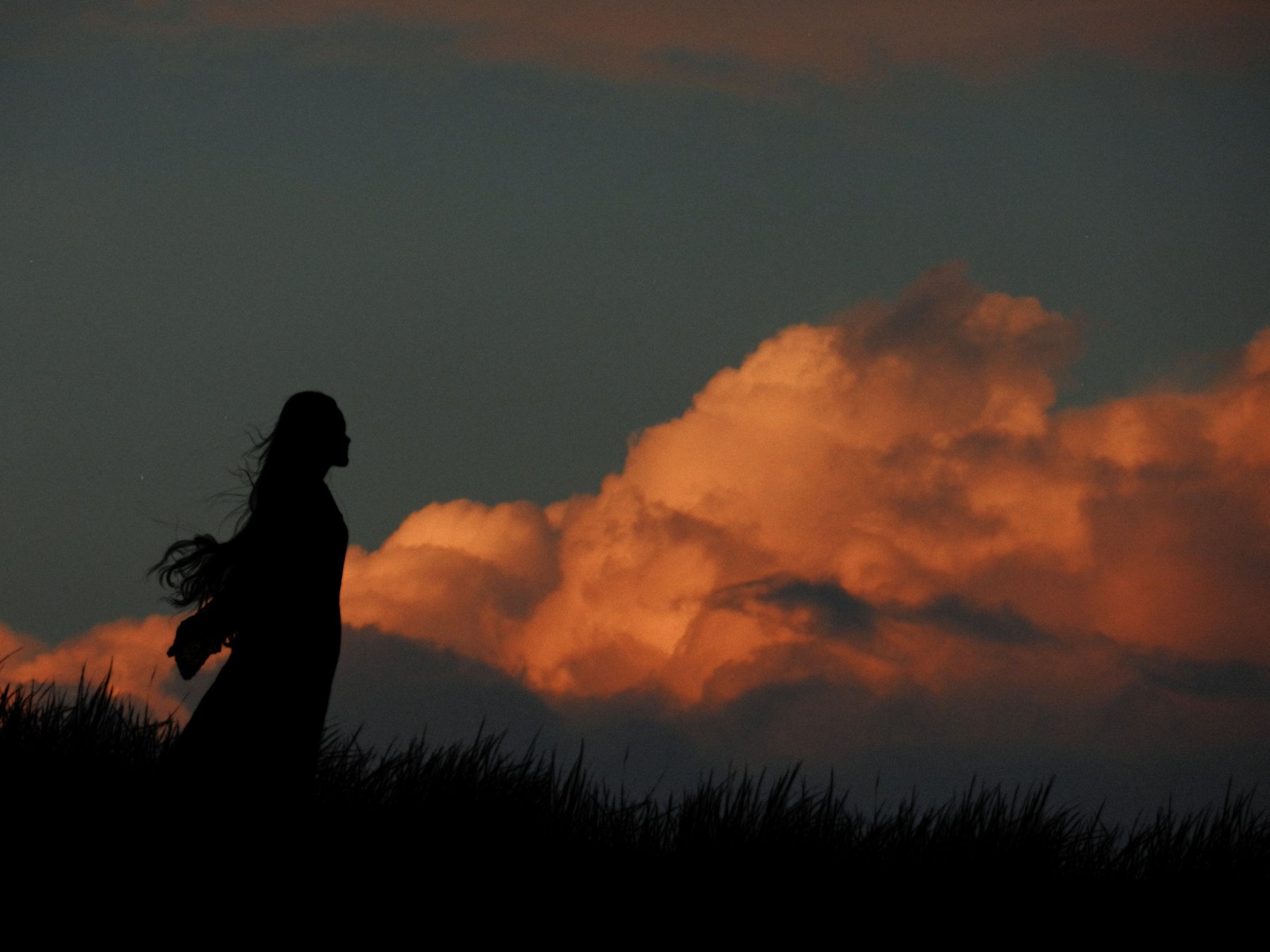 Silhouette against a burning sunset sky